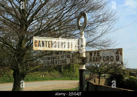 Old signpost pointing towards Canterbury, Wye, Ashford, Stowting, Folkestone and Hythe at Elmsted on the Kent Downs above Ashford, Kent, England, Unit Stock Photo