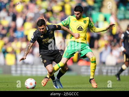 Newcastle United's Bruno Guimaraes (left) and Norwich City's Pierre Lees-Melou battle for the ball during the Premier League match at Carrow Road, Norwich. Picture date: Saturday April 23, 2022. Stock Photo