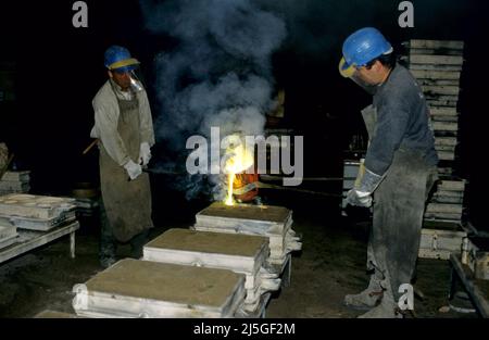 Bell foundry. Casting of molten metal. Herepian, Occitanie, France Stock Photo