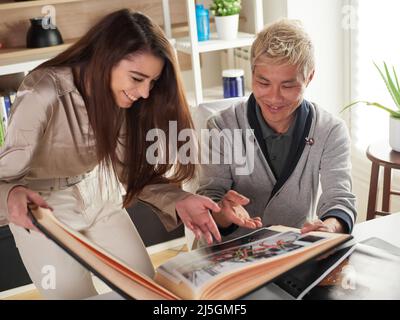 photographers working with laptop at the working place with two computers in the studio Stock Photo