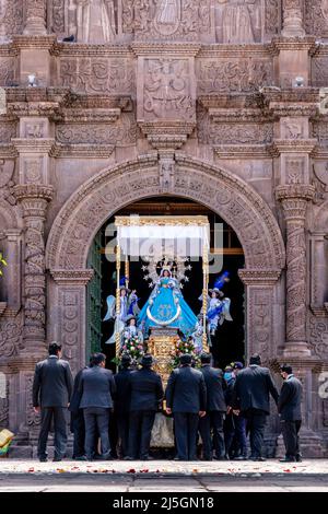 A Statue Of The Virgin Mary Is Carried Into The Cathedral During The Fiesta De La Virgen De La Candelaria, Plaza De Armas, Puno, Puno Province, Peru. Stock Photo