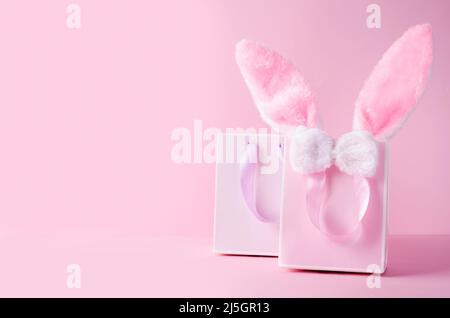 The concept of online stores for Easter, buying and selling for the holiday. Gift bag with hare ears Stock Photo