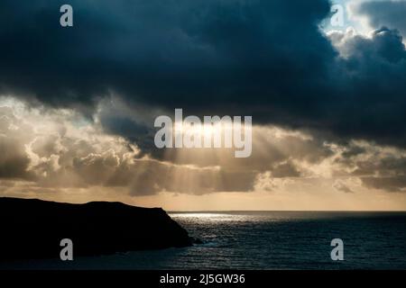 Evening clouds forming crepuscular rays, jacobs ladder, Hope Cove, South Devon, from the south west coast path, devon, england Stock Photo