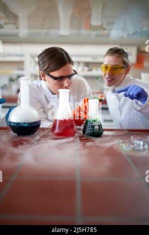 students in uniform making some experiment in lab Stock Photo