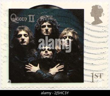 Photo of a British postage stamp with the cover of the album Queen II commemorating the rock band 2020 Stock Photo