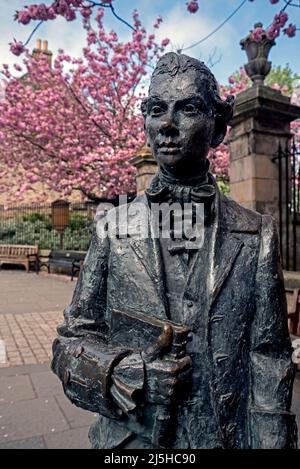 Statue in memory of the Scottish poet Robert Fergusson (1750-74) outside Canongate Kirk in Edinburgh. Stock Photo