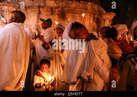 Ethiopian Orthodox worshippers take part in the Holy Fire ceremony at the Ethiopian section of the Church of the Holy Sepulchre in Jerusalem's Old City, April 23, 2022. REUTERS/Ammar Awad
