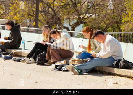 art students drawing on the streets Seville Sevilla Spain Stock Photo