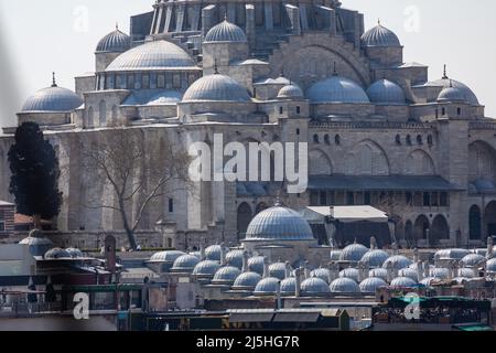 High angle zoomed view of Suleymaniye Mosque over the roofs of Eminonu located on the historical peninsula, the Third Hill of Istanbul, Turkey Stock Photo