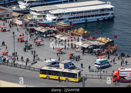 High angle aerial zoomed view of Eminonu municipal bus stop on the coast of the Golden Horn in Istanbul, Turkey on April 8, 2022. Stock Photo