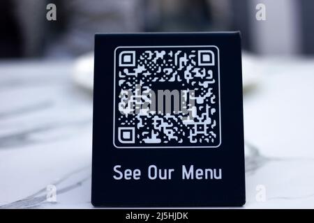 QR code generator table. With the abstract restaurant menu QR code concept, your orders are given with the help of technology. Stock Photo