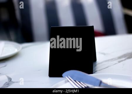 Restaurant themed abstract empty black isolated table. Can be used for QR or advertisement. Stock Photo