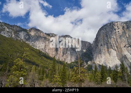 Ribbon Falls and side of El Capitan in Yosemite National Park, California; sunny partly cloudy spring day. Stock Photo