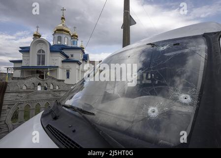 Borodyanka, Ukraine. 23rd Apr, 2022. A van riddled with bullets marks is parked near a church in Borodyanka, Ukriane on Saturday, April 23, 2022. A planned evacuation of civilians in the besieged southern city of Mariupol on Saturday was again thwarted by the Russian military, according to Ukrainian leaders. Photo by Ken Cedeno/UPI Credit: UPI/Alamy Live News Stock Photo