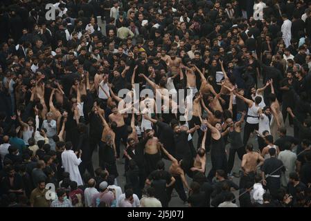 Lahore, Punjab, Pakistan. 23rd Apr, 2022. Pakistani Shiite Muslims are participating in the mourning procession during the day of martyrdom of Hazrat Ali Al-Murtaza (A.S) from Bhati Gate to Imambargah Karbala Gamay Shah in Lahore. Shiite Muslims from all over the world are holding mourning procession on the occasion of Youm-e-Ali (A.S), the day of martyrdom 21st Ramadan. a procession to commemorate the 7th century killing of Imam Ali during the holy fasting month of Ramadan al Mubarak. (Credit Image: © Rana Sajid Hussain/Pacific Press via ZUMA Press Wire) Stock Photo