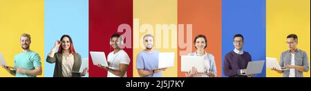 Group of young programmers with laptops on color background with space for text Stock Photo