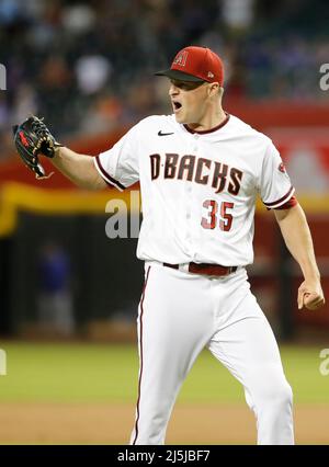 Phoenix, Arizona, USA. 23rd Apr, 2022. Kyle Nelson (50) of the Arizona  Diamondbacks walks off the field after getting the 3rd out of the to of the  same between the New York