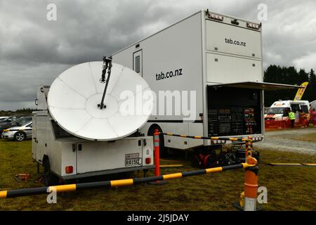 KUMARA, NEW ZEALAND, JANUARY 8, 2022; Satellite equipment broadcasts the races held at the Gold Nuggets competition at the Kumara Race Track, January Stock Photo