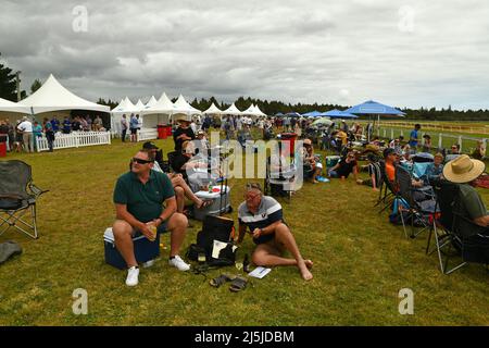 KUMARA, NEW ZEALAND, JANUARY 8, 2022; racegoers enjoy their day out during the fashion competition at the Gold Nuggets competition at the Kumara Race Stock Photo