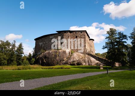 Raseborg castle, a medieval castle in Raseborg, Finland in summertime with blue sky and clouds in the background. Stock Photo