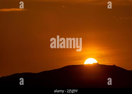 Sunset over the Jubilee Tower on the summit of Moel Famau, North Wales Stock Photo