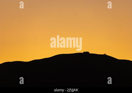Jubliee Tower in silhouette on the summit of Moel Famau, North Wales Stock Photo