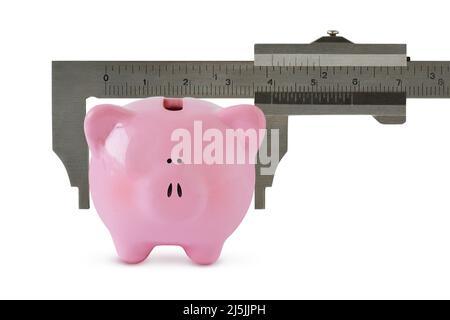 Piggy bank with vernier caliper on white background - Concept of economy and savings Stock Photo