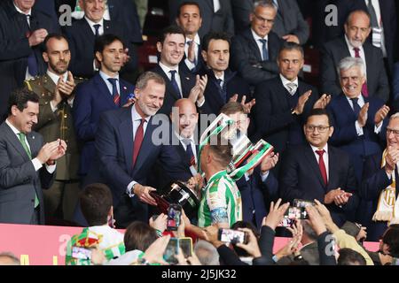 Joaquin Sanchez of Real Betis receives the winners trophy by Felipe VI, King of Spain, after winning the Spanish Cup, Copa del Rey, Final football match between Real Betis Balompie and Valencia CF on April 23, 2022 at Estadio de la Cartuja in Sevilla, Spain - Photo: Joaquin Corchero/DPPI/LiveMedia Stock Photo