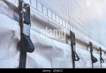 detail of the straps and tensioners of a truck tarpaulin Stock Photo