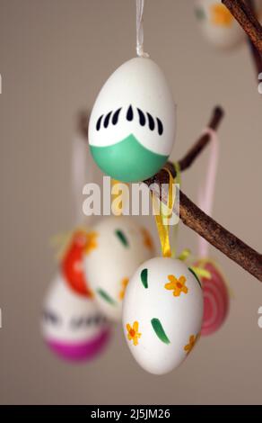 Easter eggs displayed on branch Stock Photo