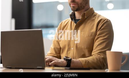 Unrecognizable Businessman Using Laptop Computer Typing Working In Office Stock Photo