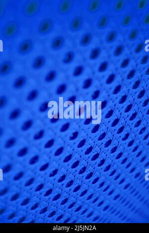 Blue vertical neon abstract pattern with holes and lines. Digital and music textures and backdrops Stock Photo