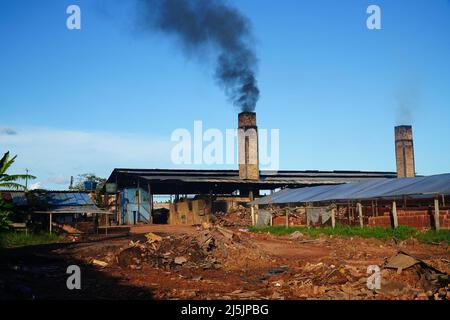 Old red truck loaded and overloaded with freshly baked bricks near Manaus, Amazonas, Brazil. Stock Photo