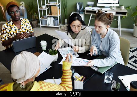Portrait of diverse creative team collaborating at business meeting and brainstorming ideas Stock Photo