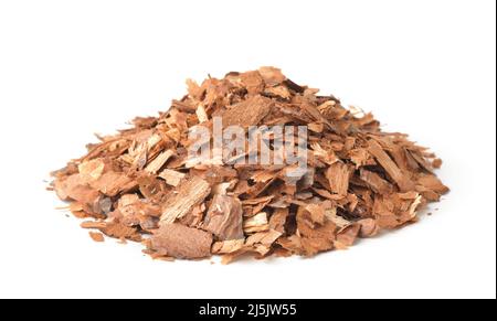 Heap of pine bark mulch chips isolated on white Stock Photo