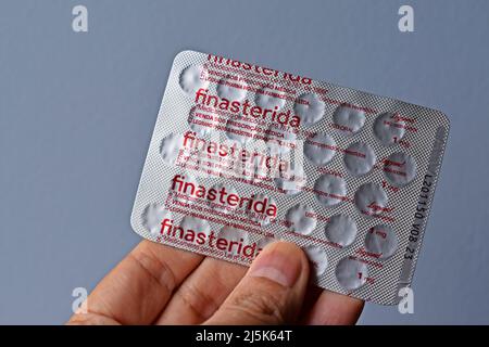 RIO DE JANEIRO, BRAZIL - FEBRUARY 19, 2022: Blister pack of finasteride pills on hand Stock Photo