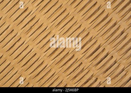 Brown wrapping corrugated cardboard with perforation. Kraft paper. Abstract background Stock Photo