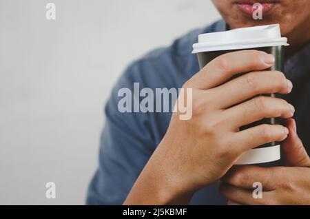 man drinking coffee paper cup copy space. Stock Photo