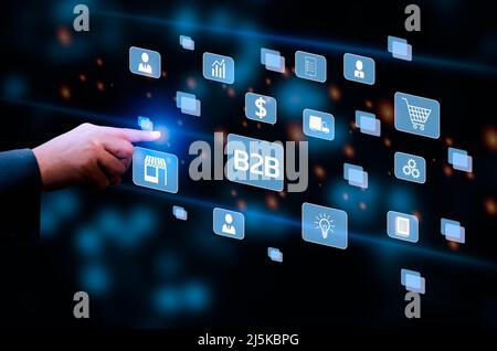 Businessman touching on virtual screen icon B2B Business to Business icons and symbols. Stock Photo