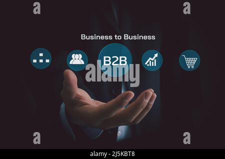 Hand businessman icon B2B Business to Business virtual screen Internet Business big data Technology Concept. Stock Photo