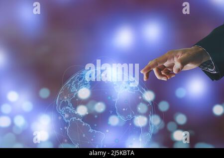 Businessman hand touching global network connecting the modern technology using the investment in the Internet network. Stock Photo
