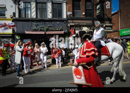 Manchester, UK. 24th Apr, 2022. The public line the streets as the annual St Georges Day parade passes through the city. Hundreds of people join in the annual celebration which marks the death of the patron Saint Of England.ÊAndy Barton/Alamy Live News Credit: Andy Barton/Alamy Live News Stock Photo