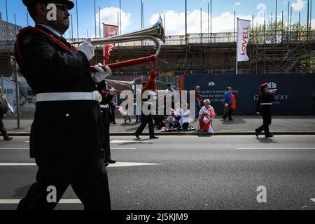 Manchester, UK. 24th Apr, 2022. The public line the streets as the annual St Georges Day parade passes through the city. Hundreds of people join in the annual celebration which marks the death of the patron Saint Of England. Credit: Andy Barton/Alamy Live News Stock Photo