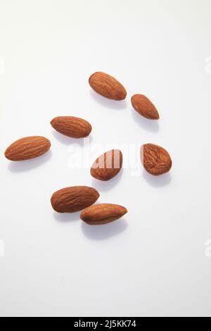 Almonds against a white background April 2022 Stock Photo