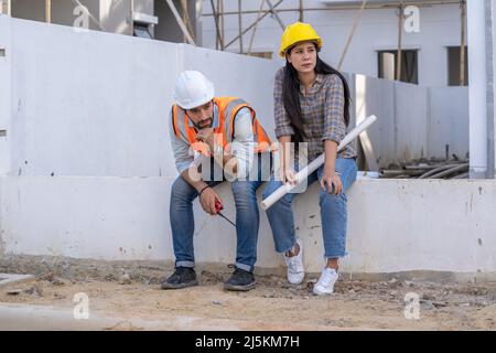 Engineer and architect are stressed at construction site,He is having problems in work,Engineering concept. Stock Photo