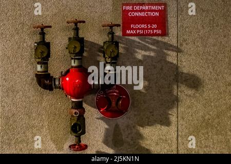 Fire hose valves and connections at a downtown tower in Battle Creek, Michigan, USA [No property release; editorial licensing only] Stock Photo