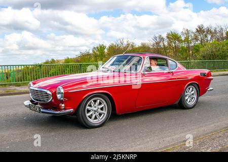 1971 70s seventies red Volvo 1986cc petrol 2dr two saloon; Volvo 1800E crossing motorway bridge in Manchester, UK Stock Photo
