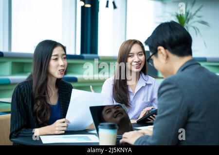Group of business partners discussing ideas and planning work in office,Successful business people. Stock Photo