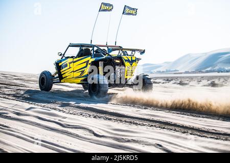 Doha, Qatar- April 22,2022: Off road buggy car in the sand dunes of the Qatari desert. Stock Photo