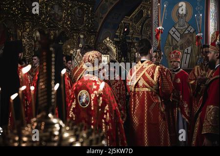 Bucha, Kyiv, Ukraine. 24th Apr, 2022. Priests seeb during the celebration. The Orthodox Easter service at night - from late Saturday night to early Sunday morning- had been celebrated inside St. Michael's Golden Domed Cathedral, in Kyiv, at the presence of the Metropolitan Epifany, the clergy and few people, due to national curfew. The ceremony has been recorded for online streaming for devoted people. (Credit Image: © Valeria Ferraro/ZUMA Press Wire) Stock Photo